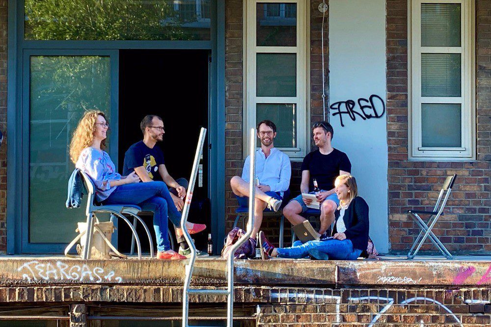 Impact Hub Leipzig team sitting on a patio together